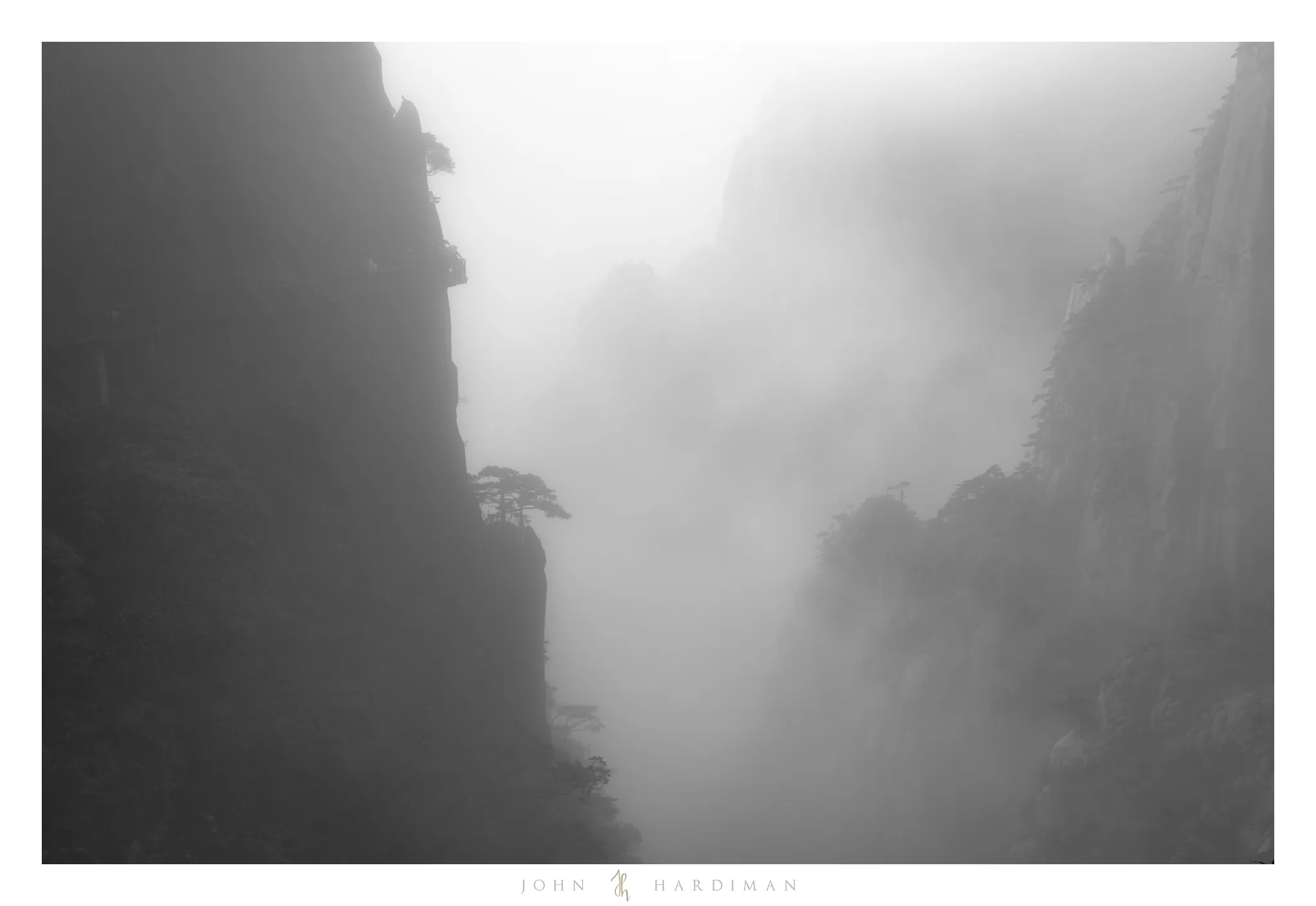 Image of steep mountain sides with fog